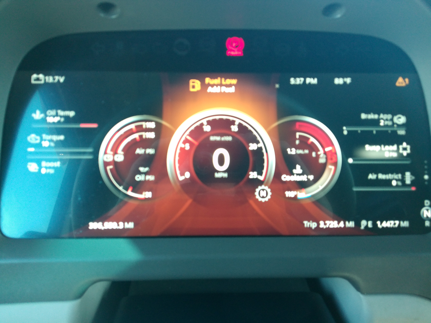 Peterbilt 579 instrument cluster display showing vehicle speed 0 mph, tachometer, and trip data; multiple gauges and warning icons visible.