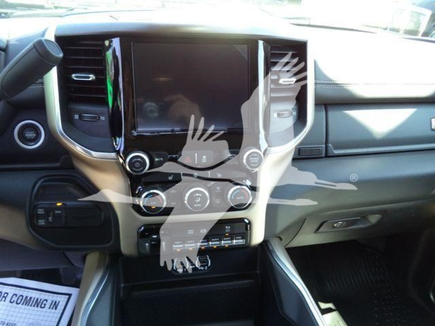 Ram 5500 interior dashboard with large central touchscreen, climate controls, and gear shifter visible.