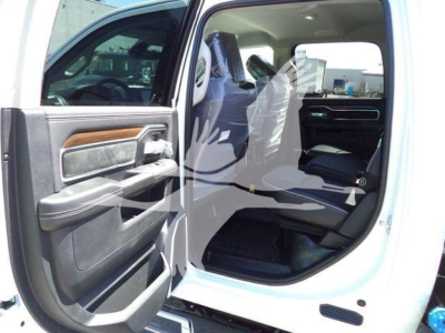 Ram 5500 interior with front passenger door open showing leather-trimmed seat and dashboard from the cab area.