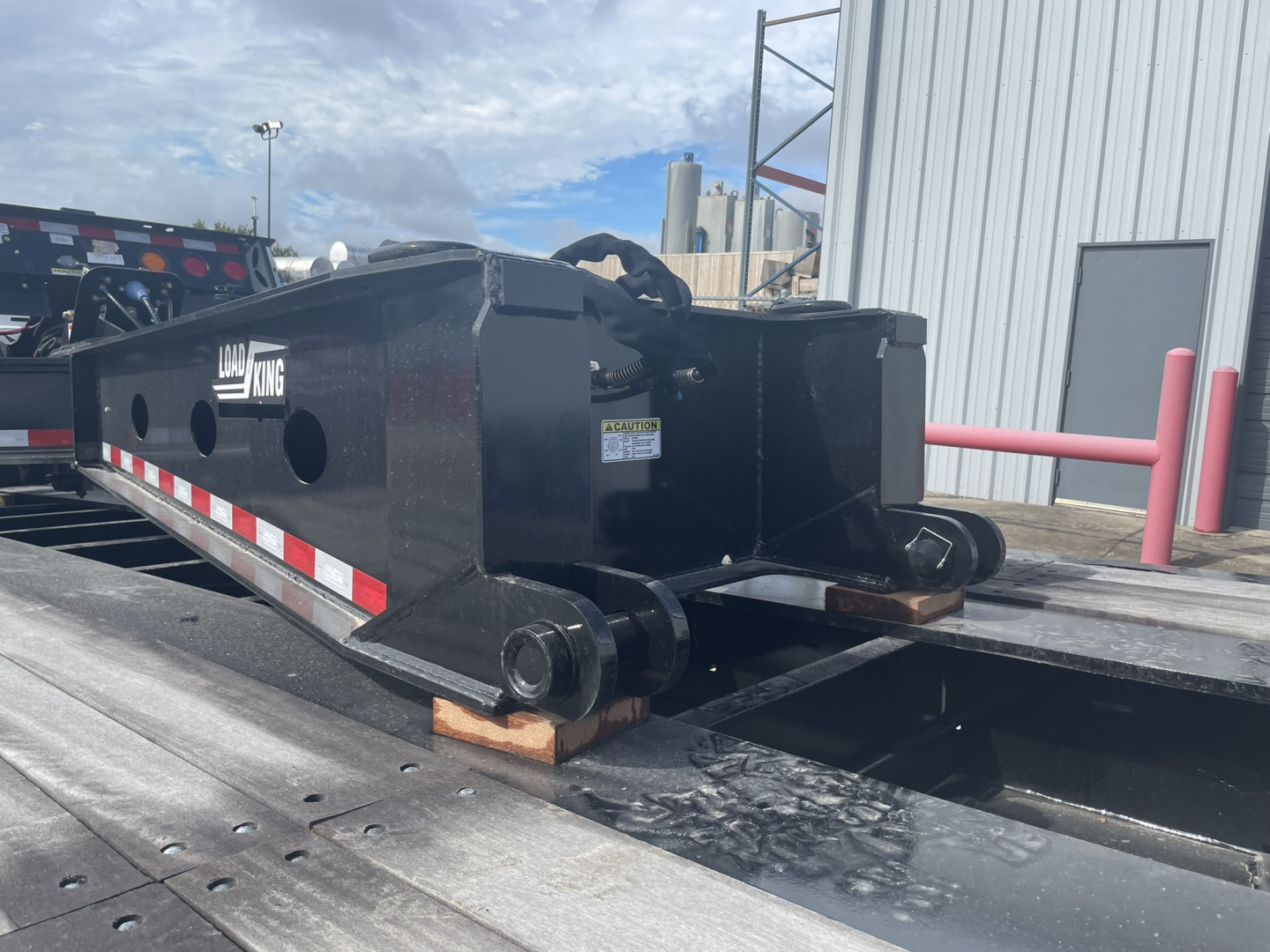 Load King SB141/2-8'-6" trailer hitch coupler in view with black steel frame, connection kingpin, reflective strip, and mounting supports.