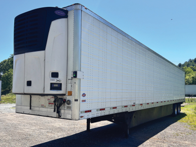 Utility 3000R reefer trailer with Thermo King reefer unit at front showing refrigeration system and side panel access.