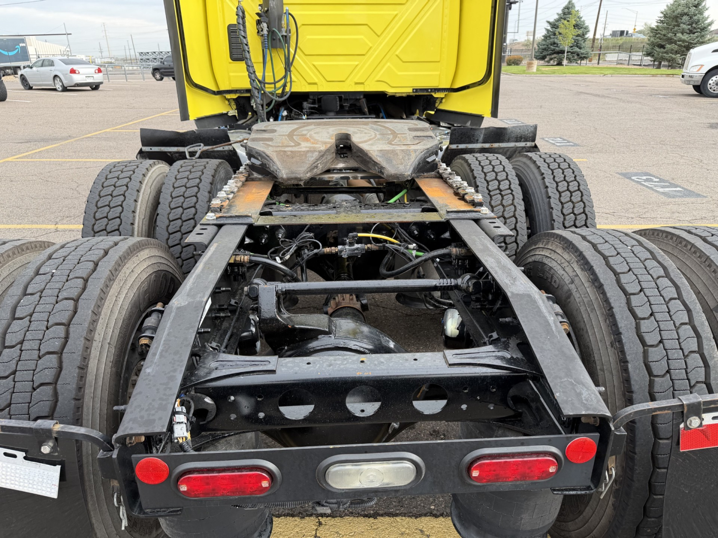 International LT625 truck chassis showing rear section, dual rear axles, frame, suspension, and rear bumper with taillights visible.