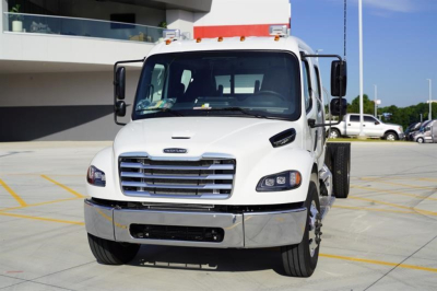 Front view of a white 2027 Freightliner M2 106 Plus cab and chassis truck with chrome grille, large headlights, and side mirrors.