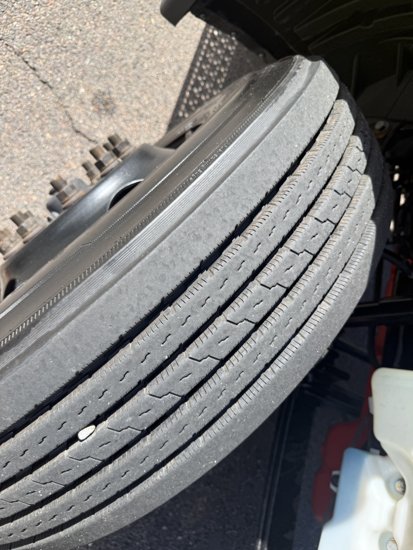 LT625 International truck wheel showing tread and tire sidewall details in-service.