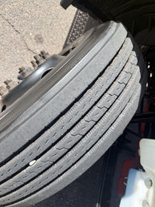LT625 International truck wheel showing tread and tire sidewall details in-service.
