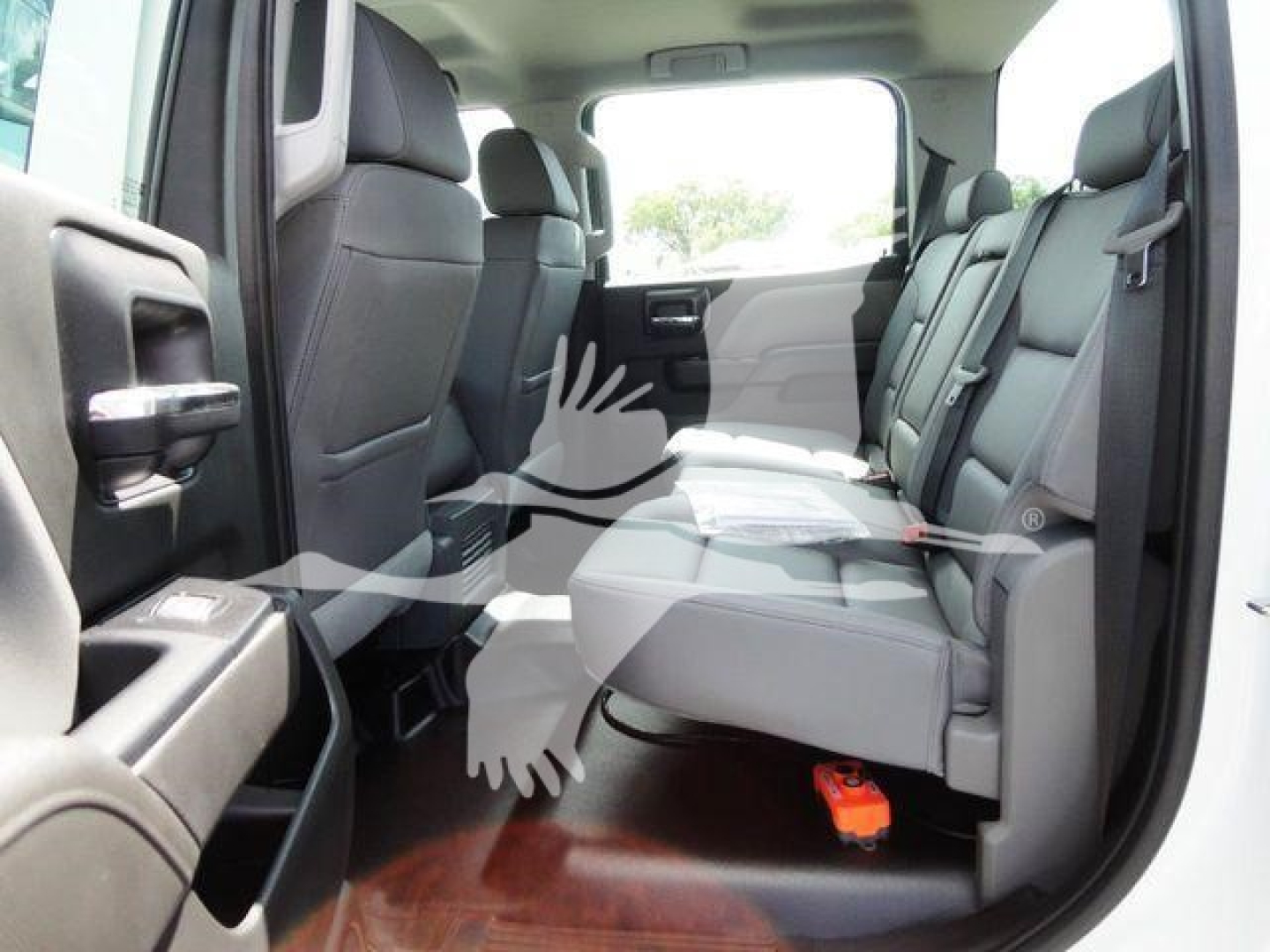 Interior of a 2023 International CV pickup crew cab showing rear seat and front seat area with visible seating and floor mats.