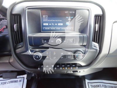 Dashboard of a 2023 International CV dump truck showing touchscreen infotainment display and climate controls.