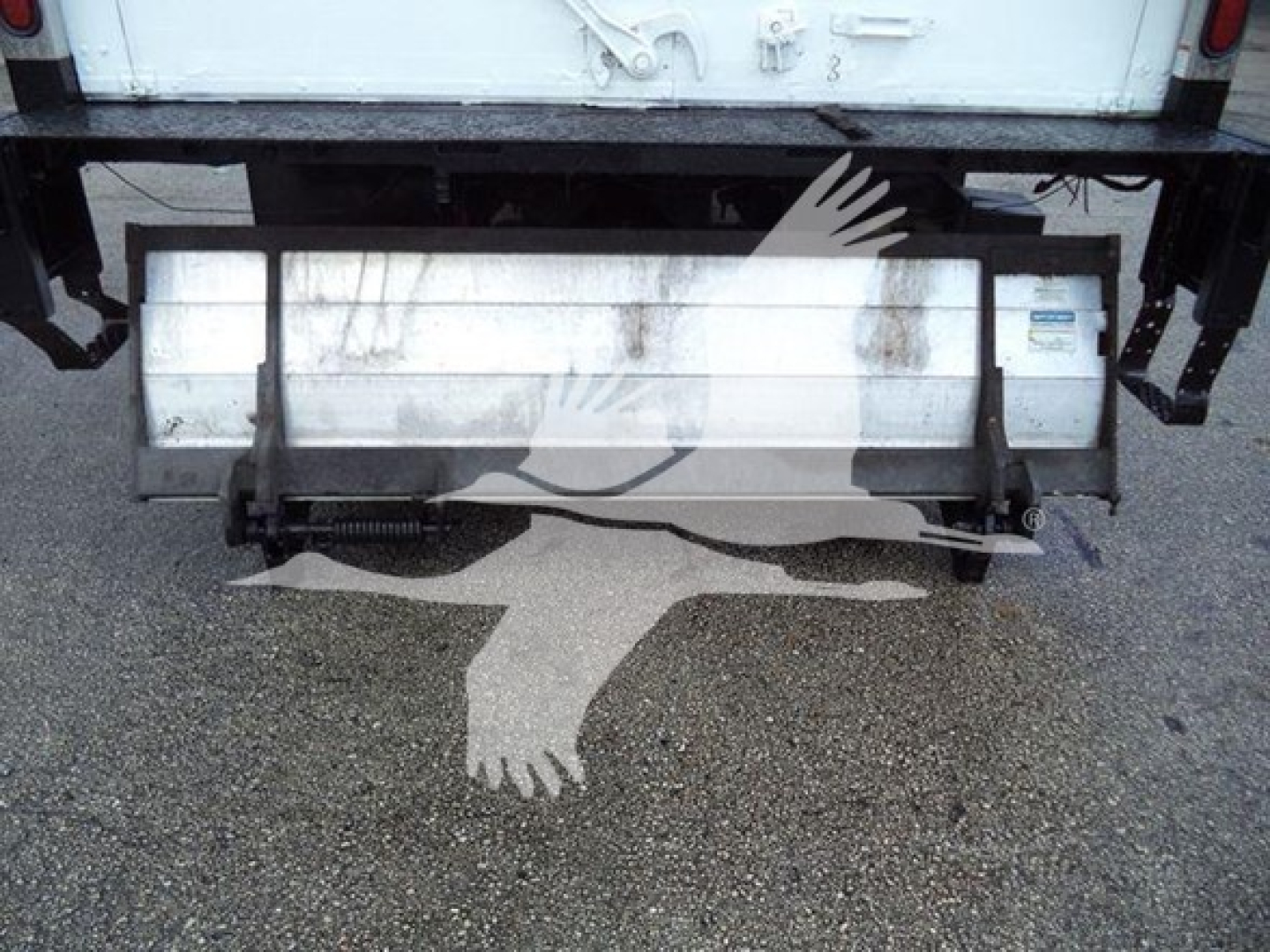 Isuzu NPR-HD truck rear showing tailgate and bumper with plate area and bumper brackets.