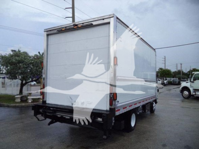 Isuzu NPR HD box truck rear view showing plain white cargo area and rear bumper with taillights.