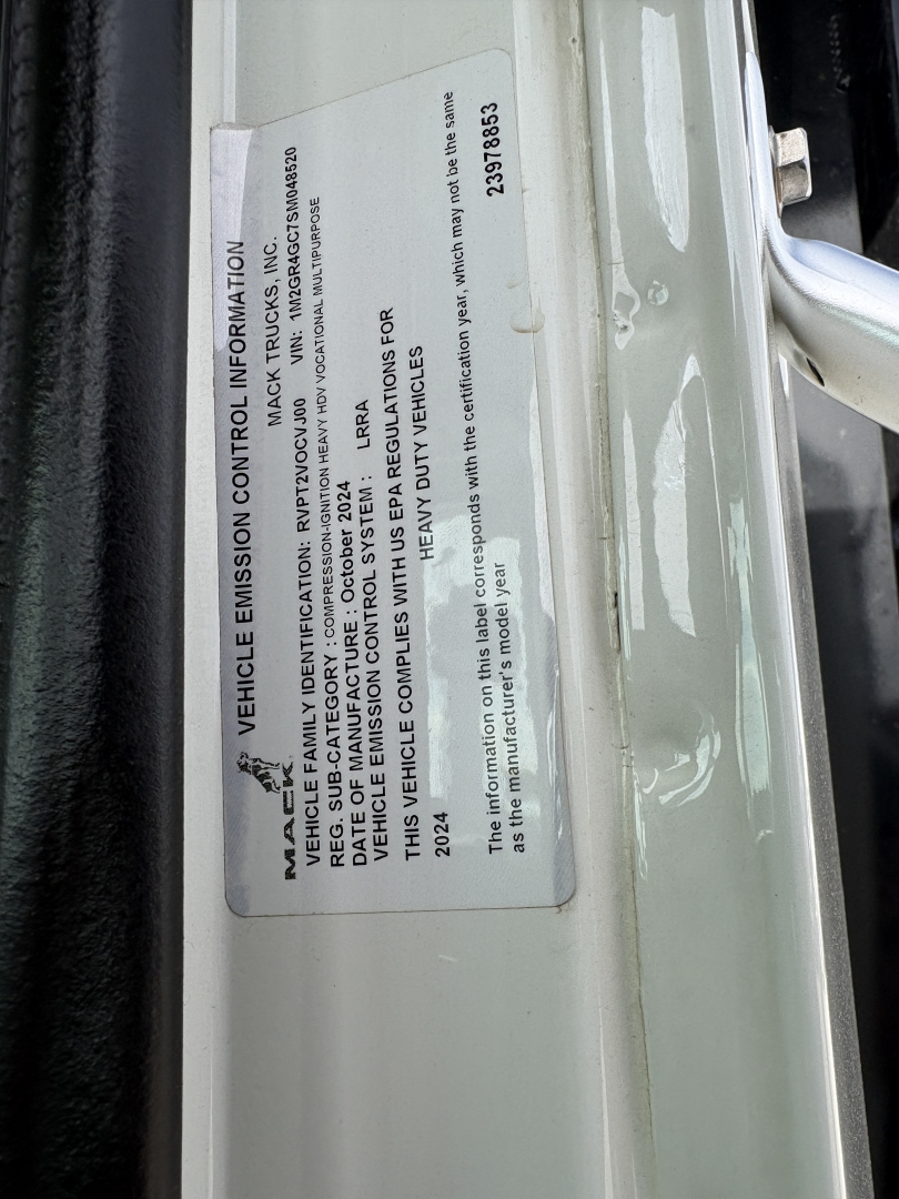 Label on vehicle door with Vehicle Emission Control Information; text includes MACS emissions information, warranty, and standards. Visible numbers: 2375835, 90041, 14-08-52?; orientation vertical.