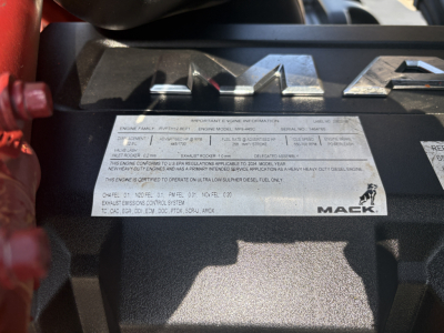 Mack engine bay label with engine information and serial details visible on the hood near RAM storage