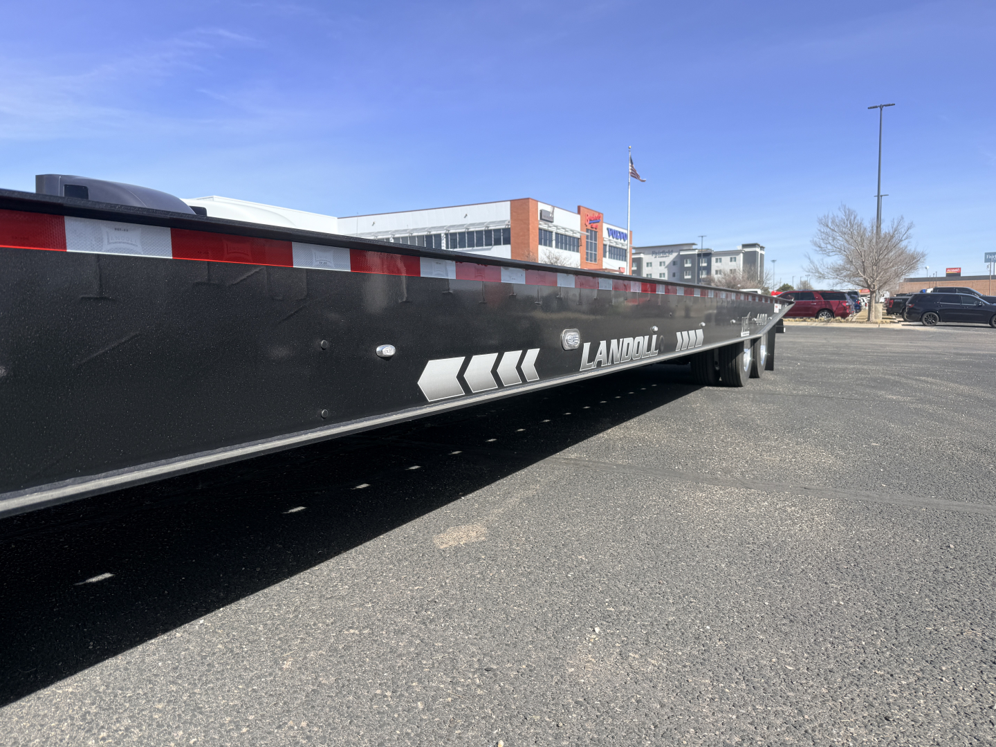 Landoll 440B-53 40-ton traveling axle lowboy trailer side view with brand markings.