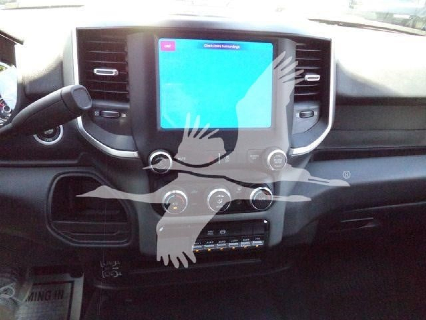 Dashboard of a 2024 Ram 5500 SLT showing a large central touchscreen display and control knobs.