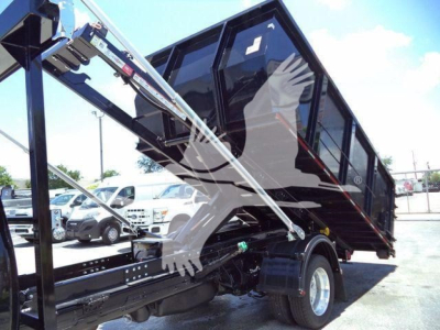 Ram 5500 SLT truck with hooklift installation showing side view and hydraulic lifting frame.