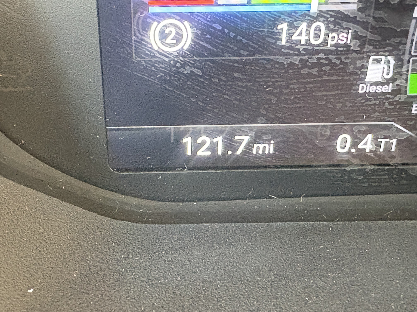 Image of a Mack AN64T truck dashboard showing 121.7 mi and 0.4 T1, 140 psi, diesel indicator, and fuel gauges.