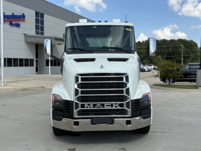Front view of a white 2027 Mack AN64T tandem tractor truck in pristine condition, chrome grille with 'MACK' badge, large headlights, and side mirrors.