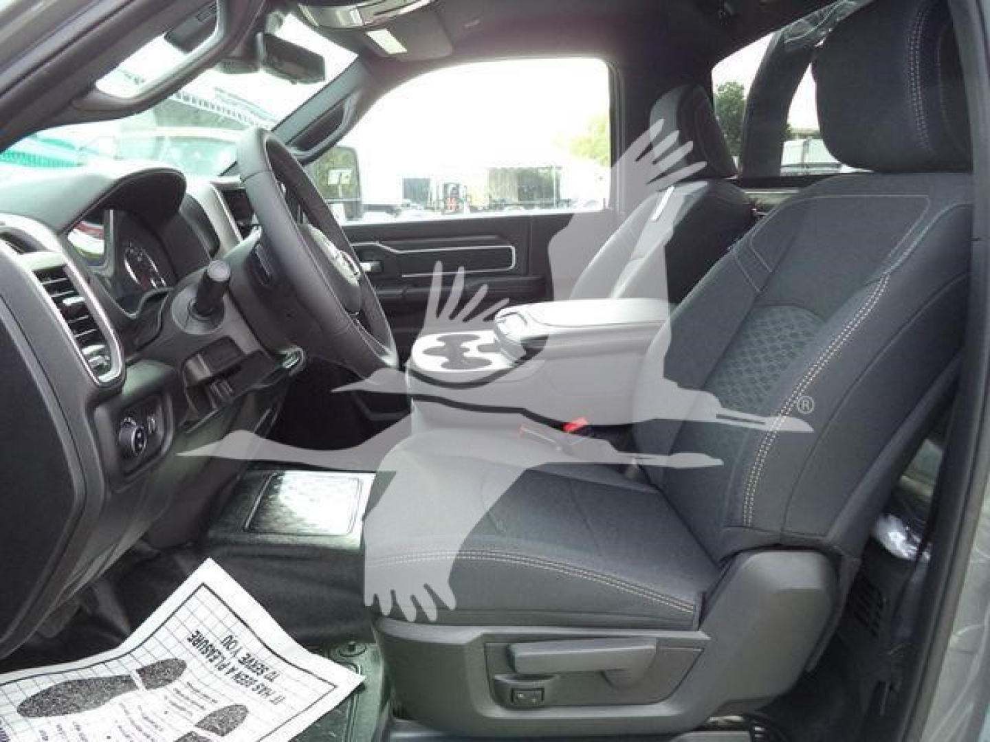 Ram 5500 pickup front interior view showing driver and passenger seats in a new 2026 Big Horn model.