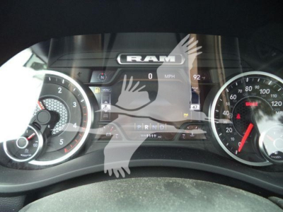 Dashboard of a 2026 Ram 5500 Big Horn showing RAM logo on digital display; gauge clusters on left and right with speedometer and tachometer; PRND gear indicator visible.