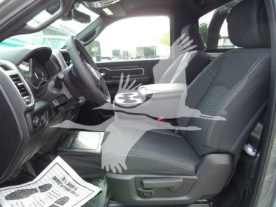 Ram 5500 pickup front interior view showing driver and passenger seats in a new 2026 Big Horn model.