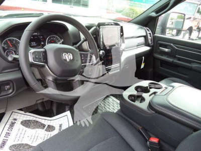 Ram 5500 Big Horn interior showing steering wheel center infotainment display dashboards and center console with cupholders