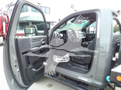 Ram 5500 Big Horn pickup truck with front passenger door open, showing interior steering wheel, dashboard, and seating.