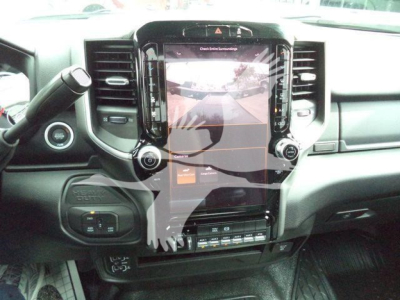 Ram 5500 interior center stack with large vertical touchscreen display showing backup camera view.
