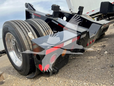 Fontaine rear flip trailer shown in a lowboy configuration with dual rear axles and hydraulic components.