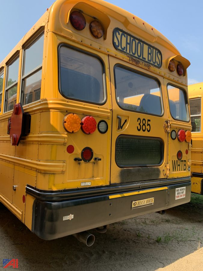 Rear view of a yellow 2017 Blue Bird Vision school bus showing rear bumper, tail lights, and license plate area with 'SCHOOL BUS' sign on top of back window.