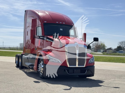 Kenworth T680 sleeper cab truck in red, front three-quarter view, showcasing grille and headlights.