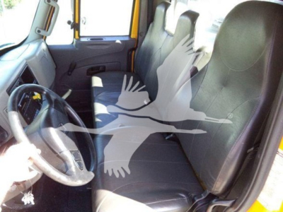 Interior of 2019 International Durastar 4300 truck showing bench seating and steering wheel.