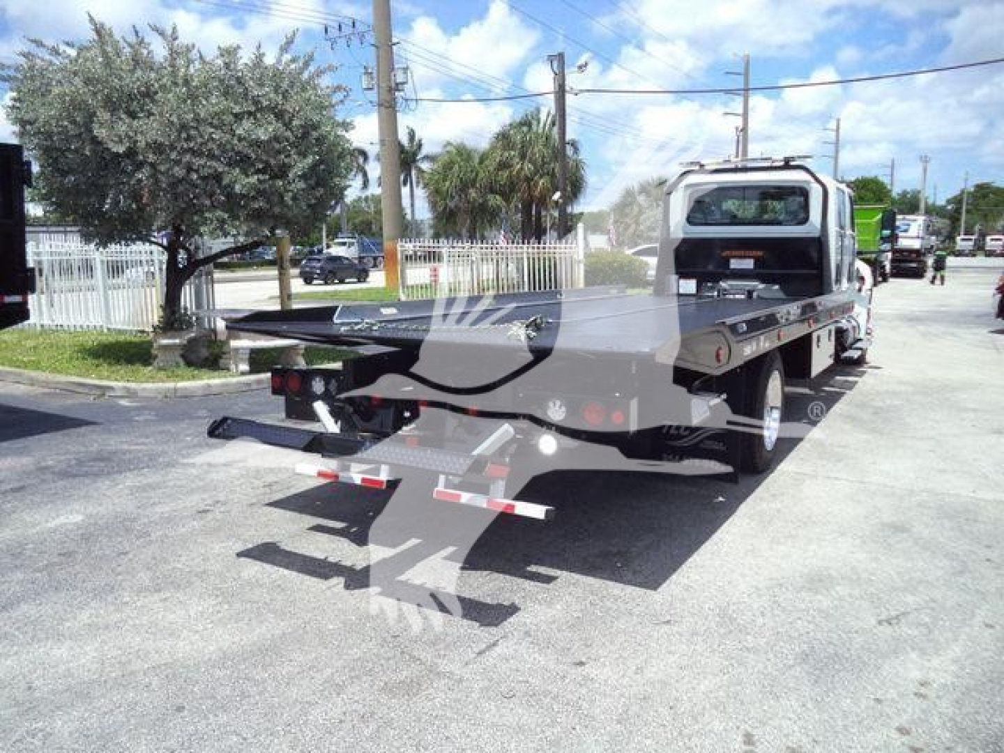 Truck bed with tow equipment and flatbed on a rollback truck, 2026 International MV, stock MVCREW22SRRD6T, new condition.