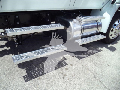 Truck with aluminum running boards and fuel tank visible, side steps with diamond tread pattern.