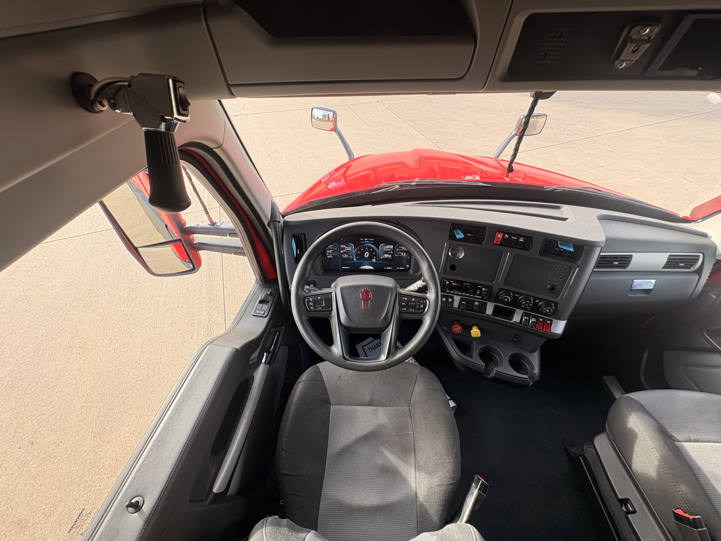 Kennwort T680 cockpit with steering wheel and dashboard visible