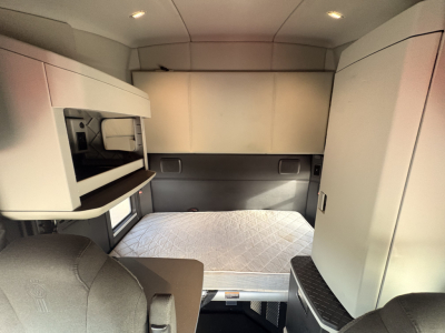 Kenworth T680 sleeper cab interior showing sleeping berth and storage compartments