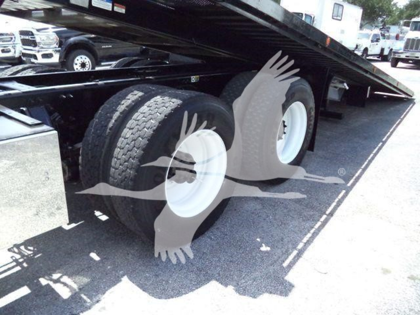 Peterbilt 348 rollback truck showing dual rear tires under flatbed in serviceable condition