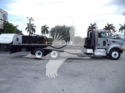 Peterbilt 348 rollback truck with attached trailer, side view, stock number T07101, used condition.