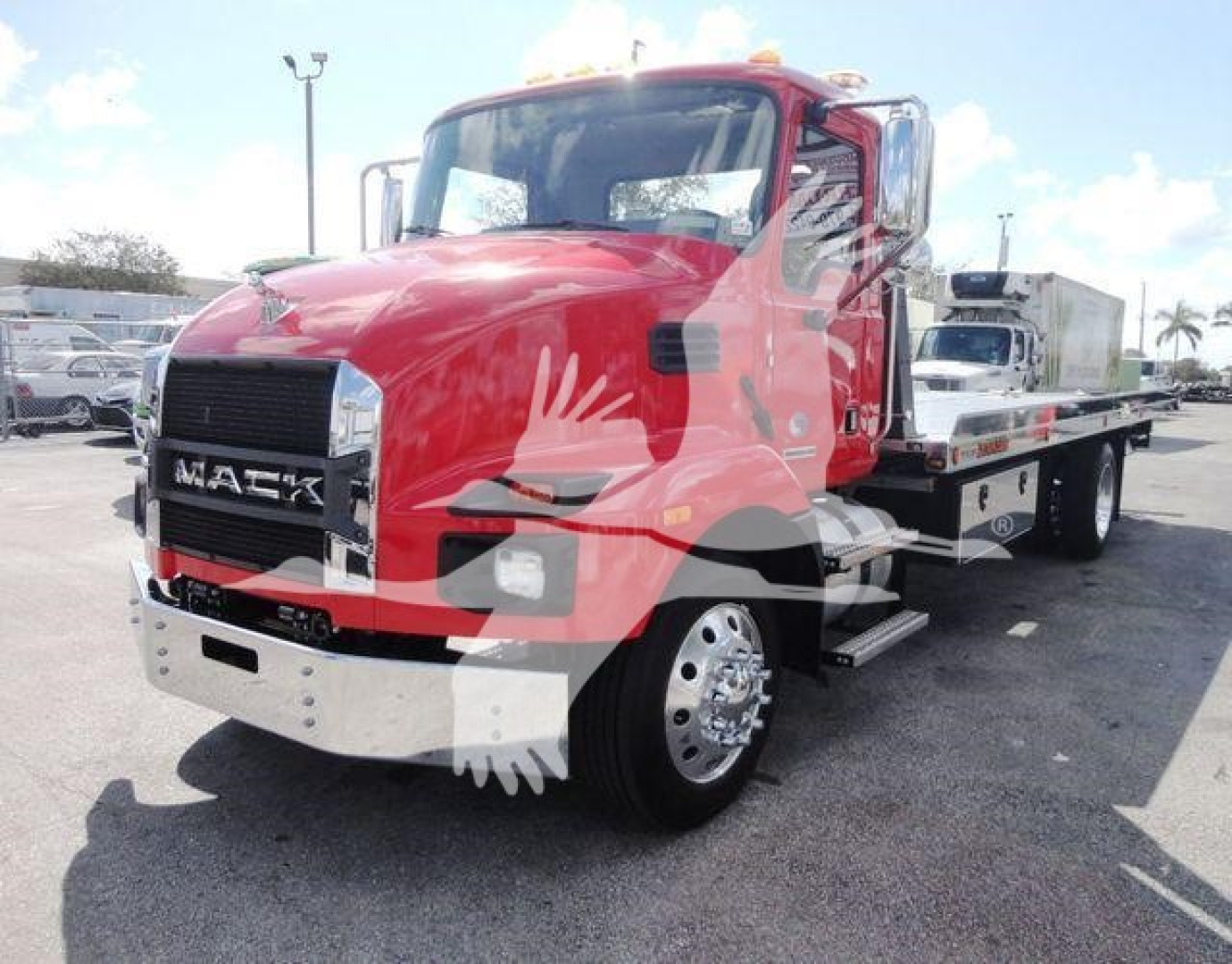 Mack MD6 rollback truck in red with flatbed, front grille, chrome bumper, and heavy-duty wheels visible.
