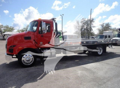 MD6 truck side view showing red cab and flatbed, stock number J04541, rollback category, new Mack MD6 chassis.