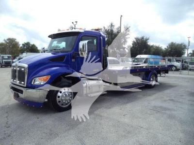 Kenworth T280 rollback truck in blue with extended flatbed and chrome front, front left view.