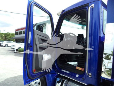 Kenworth T280 cab interior and door open showing driver seat area and entry step; blue truck with label/branding not fully legible.
