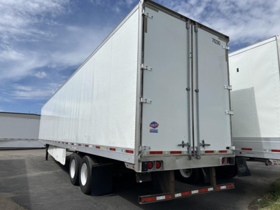Trailer rear view showing enclosed utility box with two back doors and tandem axles, 2016 Utility 4000Dx, stock UE11576.