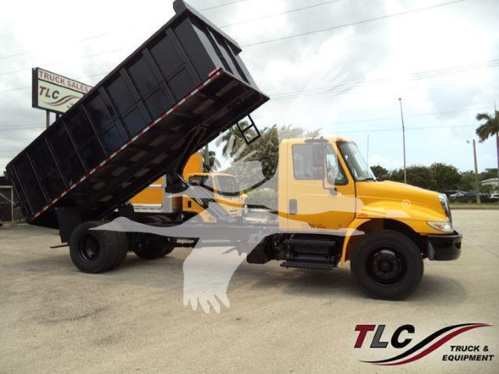 2019 International Durastar 4300 dump truck with raised dump bed, yellow cab, black dump, on lot. Front shows International emblem; CDL text not visible.