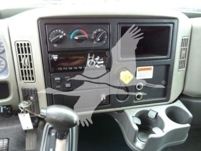 Cab interior of a 2019 International Durastar 4300 showing dashboard with climate controls, radio, empty display panel, cup holders, and ignition area.