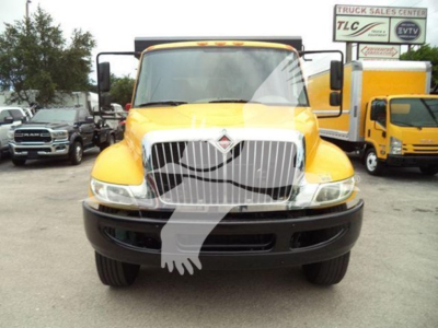 Front view of a yellow 2019 International Durastar 4300 dump truck with a prominent grille and black bumper.