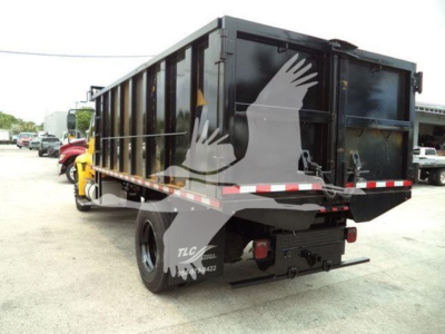 Dump truck bed and rear of 2019 International Durastar 4300 dump truck showing black dump body and rear hitch area.