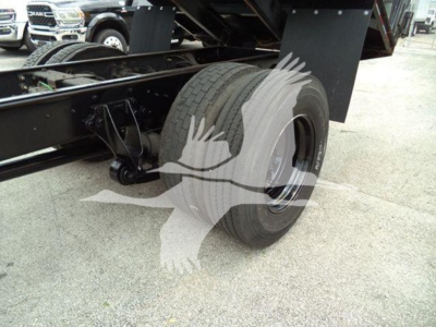 Dump truck rear wheel and chassis of a 2019 International Durastar 4300 showing rear dual wheels and suspension.