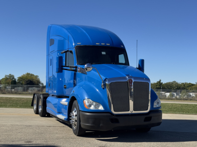 Truck front view of a blue Kenworth T680 with sleeper cab and chrome grille; no visible text on the body.