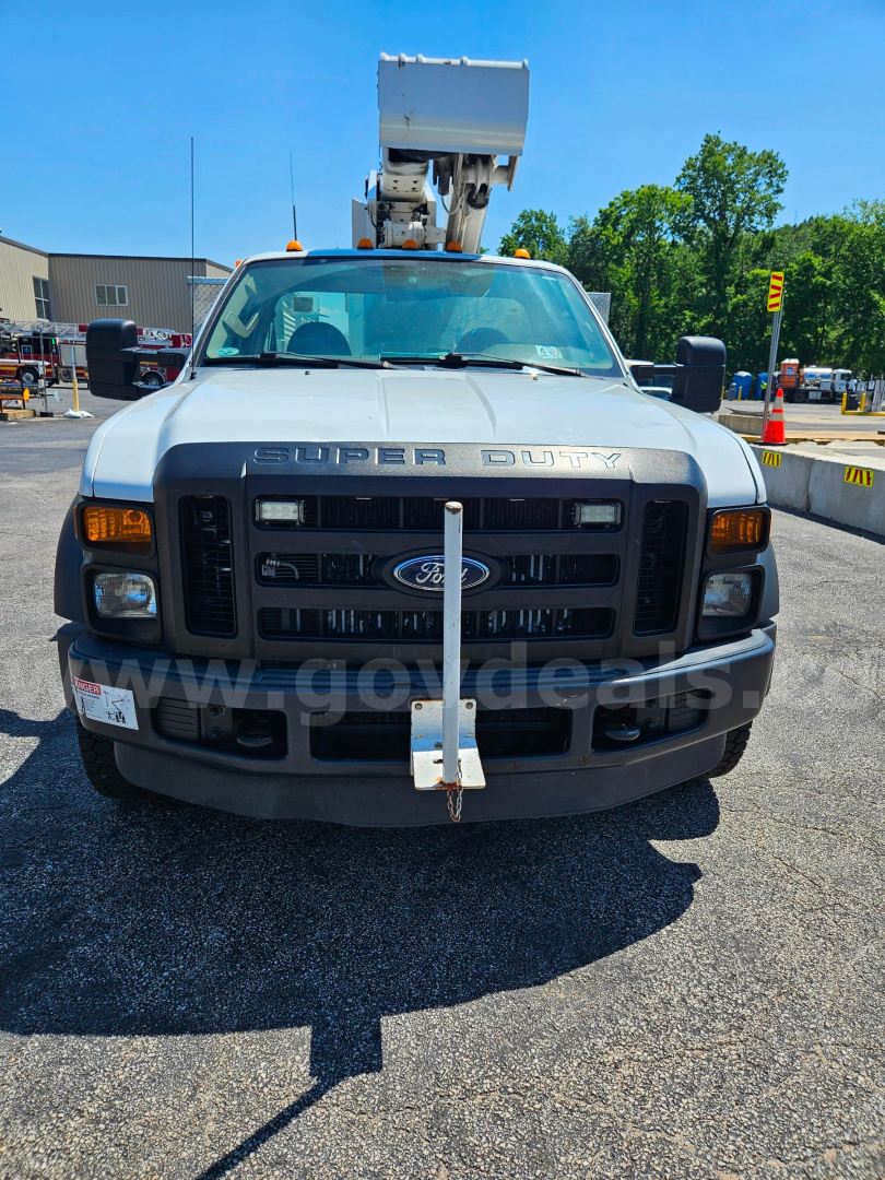 Ford F-550 service/utility truck front view with a cherry picker bucket on top, grille shows Ford emblem and 'SUPER DUTY' lettering, stock number 20376-292