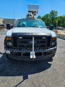 Ford F-550 service/utility truck front view with a cherry picker bucket on top, grille shows Ford emblem and 'SUPER DUTY' lettering, stock number 20376-292