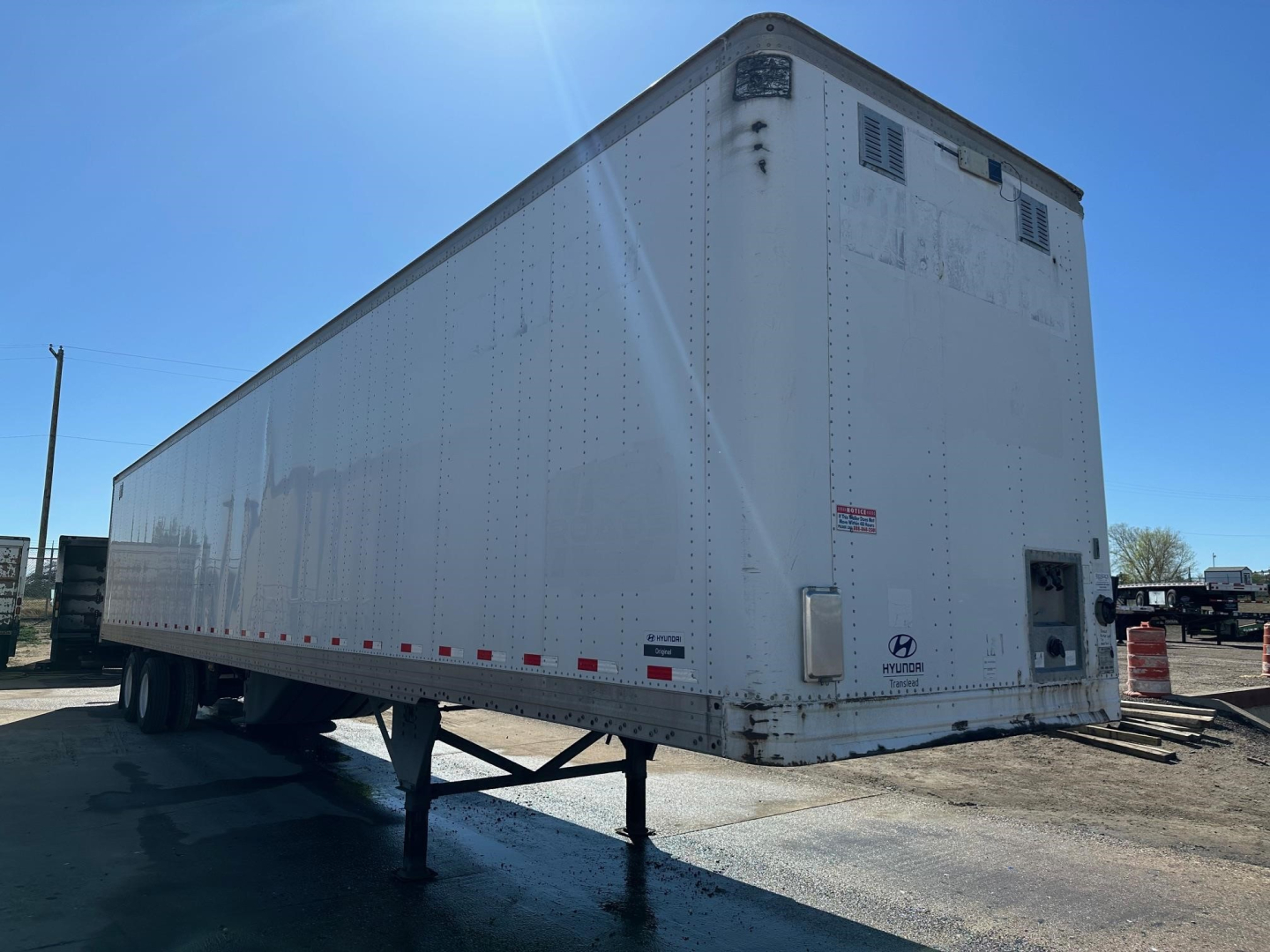 Hyundai air ride dry van trailer with roll-up doors, shown from side and rear, VIN visible, stock number 349225.